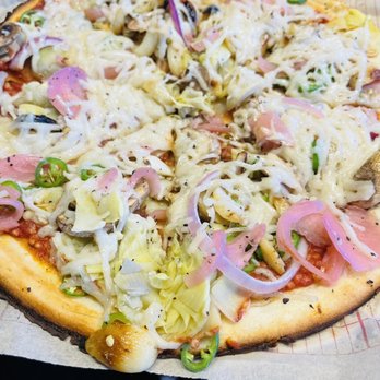 MOD Pizza - a close up of a pizza with toppings - Pizza Near Me - Pasadena, Texas MOD Pizza - a close up of a pizza with toppings - Pizza Near Me - Pasadena, Texas
