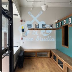 J&L Dance Studio - Part of the studio lobby area with coat hooks and shoe storage