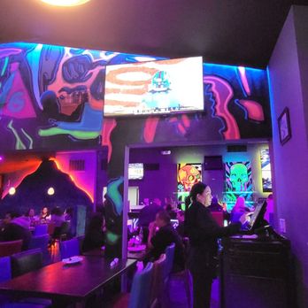 Kalaveras - Vibrant neon-soaked interior with colorful lights, blacklight accents, lively décor, and exotic festive energy. - Mexican Near Me - Orange, California Kalaveras - Vibrant neon-soaked interior with colorful lights, blacklight accents, lively décor, and exotic festive energy. - Mexican Near Me - Orange, California