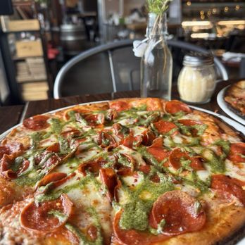 Angelos Brick Oven Pizzeria - Gluten-free pepperoni pizza with pesto drizzle - Pizza Near Me - Wildomar, California Angelos Brick Oven Pizzeria - Gluten-free pepperoni pizza with pesto drizzle - Pizza Near Me - Wildomar, California