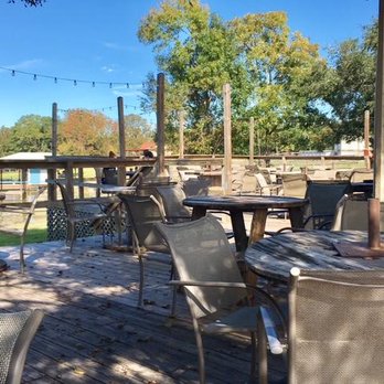 The Wet Deck - Part of the large deck overlooking the lake in November, no umbrellas needed. - American Near Me - Livingston, Texas The Wet Deck - Part of the large deck overlooking the lake in November, no umbrellas needed. - American Near Me - Livingston, Texas