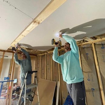 Southern Charm Remodeling - two men working on the ceiling - Roofing Near Me Southern Charm Remodeling - two men working on the ceiling - Roofing Near Me