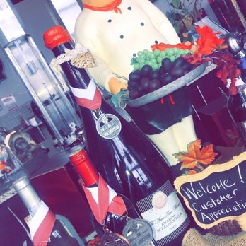 Ti Amo Fine Wines - a display of wine bottles and a statue of a chef - Wineries Near Me - Vaughan, Ontario Ti Amo Fine Wines - a display of wine bottles and a statue of a chef - Wineries Near Me - Vaughan, Ontario