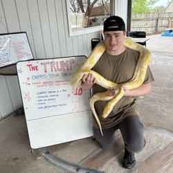 Closed On Sundays - Met one of the cooks and he posed with one of my snakes.