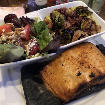 Hickory Tavern - Cedar plank salmon with tavern greens and Brussel sprouts. - Sports Bars Near Me - Rock Hill, South Carolina Hickory Tavern - Cedar plank salmon with tavern greens and Brussel sprouts. - Sports Bars Near Me - Rock Hill, South Carolina
