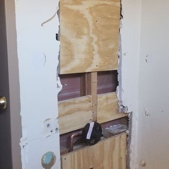 Elite Roofing & Remodeling - Next day there version of drywall this is what's behind my surround - Roofing Near Me