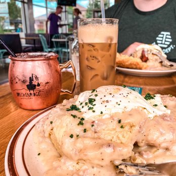 Denver Biscuit Co. - Centennial - Biscuits and gravy, moms iced latte and the strawberry rhubarb Moscow mule.   In the back: The Franklin - Breakfast & Brunch Near Me - Centennial, Colorado