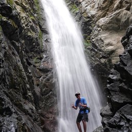 Our son in front of the falls