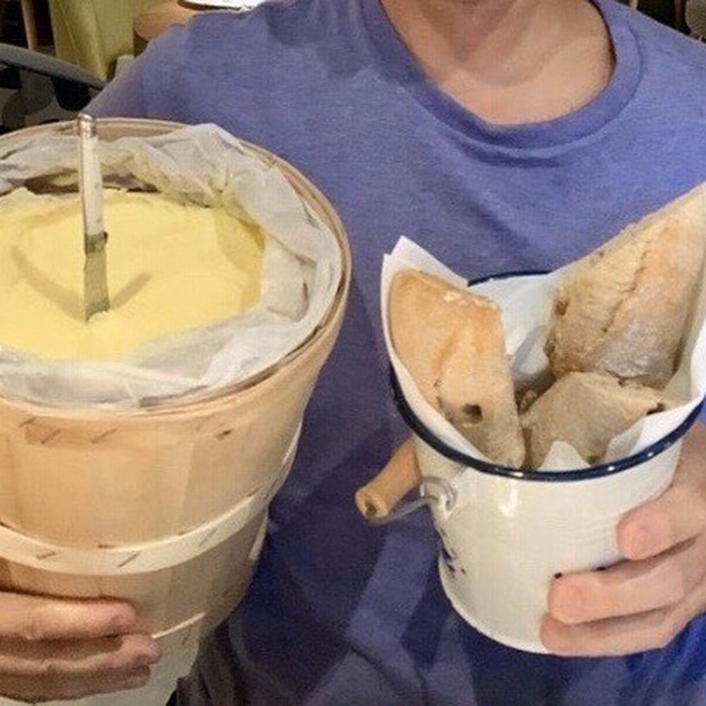 Arzábal - My husband holding the bread & bucket of butter - Spanish Near Me - Madrid, M