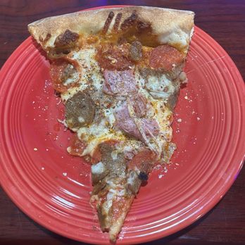 Italianos NY Pizza - A slice from a 22 inch meat lovers pizza . - Pizza Near Me - Deltona, Florida Italianos NY Pizza - A slice from a 22 inch meat lovers pizza . - Pizza Near Me - Deltona, Florida