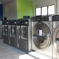 Owasso Express Laundry - One of our rows of washers - we have plenty so you won't have to wait to use a machine!