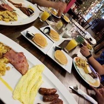 Eggsperience Vasilis - Big vasilis in front, delicious pancakes in the middle, and a greek breakfast on the right. - Creperies Near Me - Buffalo, New York