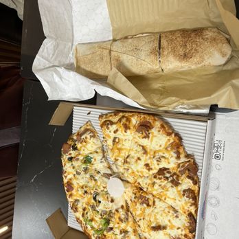Kourosh Super Market - Half deluxe half bandhari pizza and beef doner wrap - Persian/Iranian Near Me - Toronto, Ontario Kourosh Super Market - Half deluxe half bandhari pizza and beef doner wrap - Persian/Iranian Near Me - Toronto, Ontario