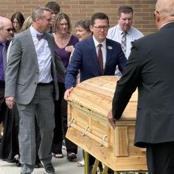 Utah Valley Mortuary - Our service team escorting casket and family to hearse.