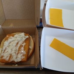 McDonald's - Fish Sandwich with Half Slice of American Cheese , as given with request to have Cheese on the side.