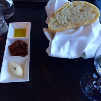 Scarpetta - Dipping sauces for the bread basket. Lemon mascarpone butter, citrus oil, and a sun dried tomato pesto - Italian Near Me - Las Vegas, Nevada