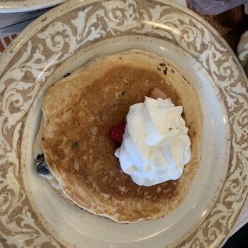 Another Broken Egg Cafe - Sweet temptation mixed trio pancakes topped with sliced strawberries & whipped cream - Breakfast & Brunch Near Me - Shreveport, Louisiana