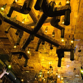 Wine Watch - Cool wine bottle & cork fixtures and wood wine label box ceiling - Beer, Wine & Spirits Near Me - Fort Lauderdale, Florida Wine Watch - Cool wine bottle & cork fixtures and wood wine label box ceiling - Beer, Wine & Spirits Near Me - Fort Lauderdale, Florida