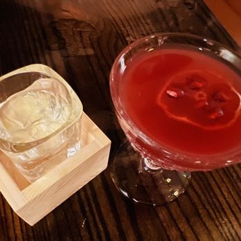Fuki Japanese Cuisine - Cosmo with pomegranate seeds floating on a slice of lime, and a glass of cold Junmai sake. - Sushi Bars Near Me - Somerville, Massachusetts