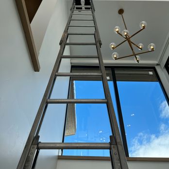 Eckland Window Cleaning - Our ladders help us safely clean the top floors! - Window Washing Near Me
