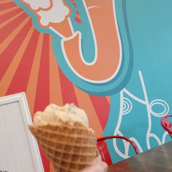 Jubie’s Creamery - a woman eating an ice cream cone - Ice Cream & Frozen Yogurt Near Me - Moraine, Ohio Jubie’s Creamery - a woman eating an ice cream cone - Ice Cream & Frozen Yogurt Near Me - Moraine, Ohio