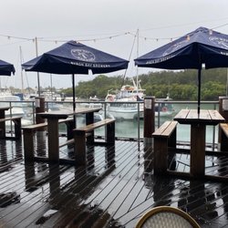 Ivory Tavern - The lookout on a rainy day, boats at the wharf.
