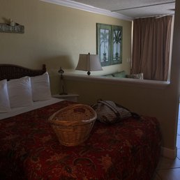 Queen bed, living room space, and door out to balcony Queen bed, living room space, and door out to balcony