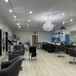 Yuna Hair Salon - New Location July 2023. They have a lounge area in the left corner, with tea coffee and treats for guests to enjoy.