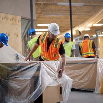 ServiceMaster Yuma - workers in a warehouse - Damage Restoration Near Me - Yuma, Arizona ServiceMaster Yuma - workers in a warehouse - Damage Restoration Near Me - Yuma, Arizona