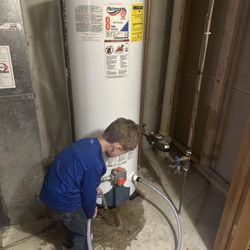 BlueBird Plumbing Heating and Air - Bring your kid to work day! Helping drain the water heater