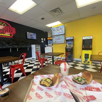 Mashed Burgers - Definitely a chill interior, complete with Pac-Man and Mortal Combat! Love their logo. - Burgers Near Me - Cliffside Park, New Jersey