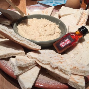 Nando's Peri-Peri - Hummus with a peri-peri drizzle! - Chicken Shop Near Me - Chicago, Illinois