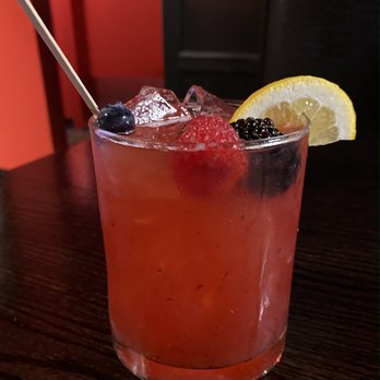 Red House - a drink with a straw and a lemon wedge - New American Near Me - Deep River, Connecticut