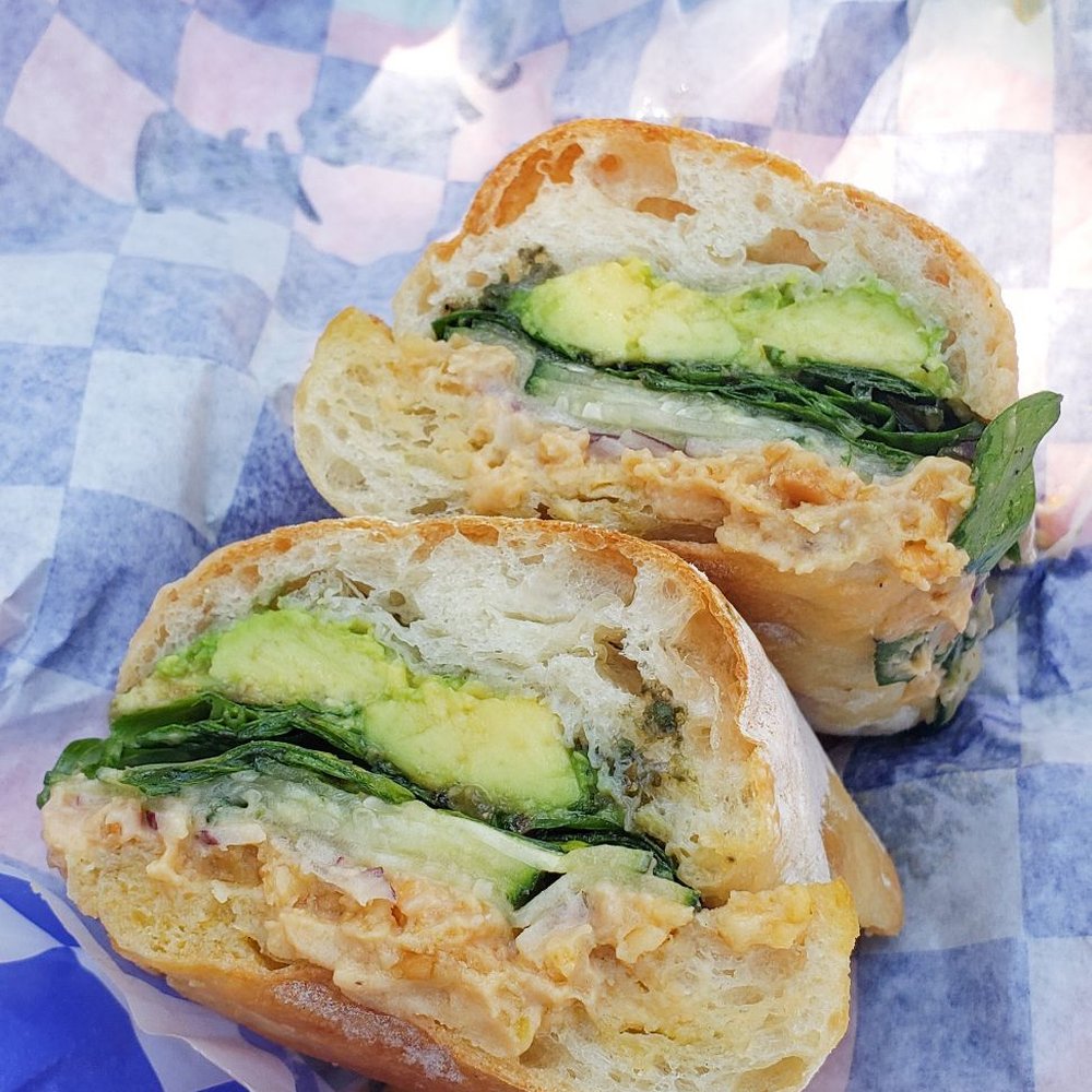 Breadlam - Valencia (vegan) - hummus, avocado, greens, cucumber, basil, crushed almonds, and red onion - Sandwiches Near Me - Los Angeles, California Breadlam - Valencia (vegan) - hummus, avocado, greens, cucumber, basil, crushed almonds, and red onion - Sandwiches Near Me - Los Angeles, California