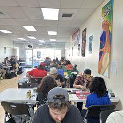 JJ’s collectibles - Gamers playing Magic the Gathering.