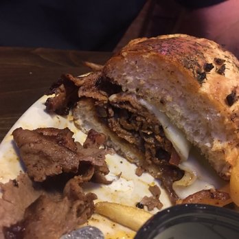 The Red Wagon - Steak sandwich cut in half. Looks good until you look at the meat. - American Near Me - Poseyville, Indiana The Red Wagon - Steak sandwich cut in half. Looks good until you look at the meat. - American Near Me - Poseyville, Indiana