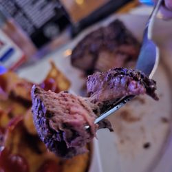 Sidewinders Steakhouse & Saloon - A fork holding a piece of the Filet.