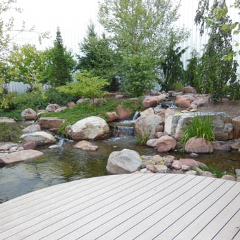 Premiere Aquascapes - a wooden deck overlooking a pond - Landscaping Near Me - Middlebury, Indiana Premiere Aquascapes - a wooden deck overlooking a pond - Landscaping Near Me - Middlebury, Indiana