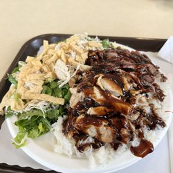 Rascals Teriyaki Grill - Teriyaki combo Teri Deluxe (half chicken half beef) with a Chinese Chicken Salad. $12.75 as of March 2023 and totally delicious.