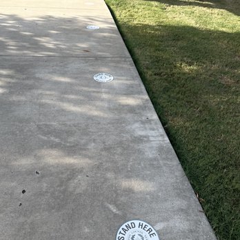 Sandy Jacobs Government Center - 7-18-2022  social distancing stickers while you wait outside. - Public Services & Government Near Me - Carrollton, Texas