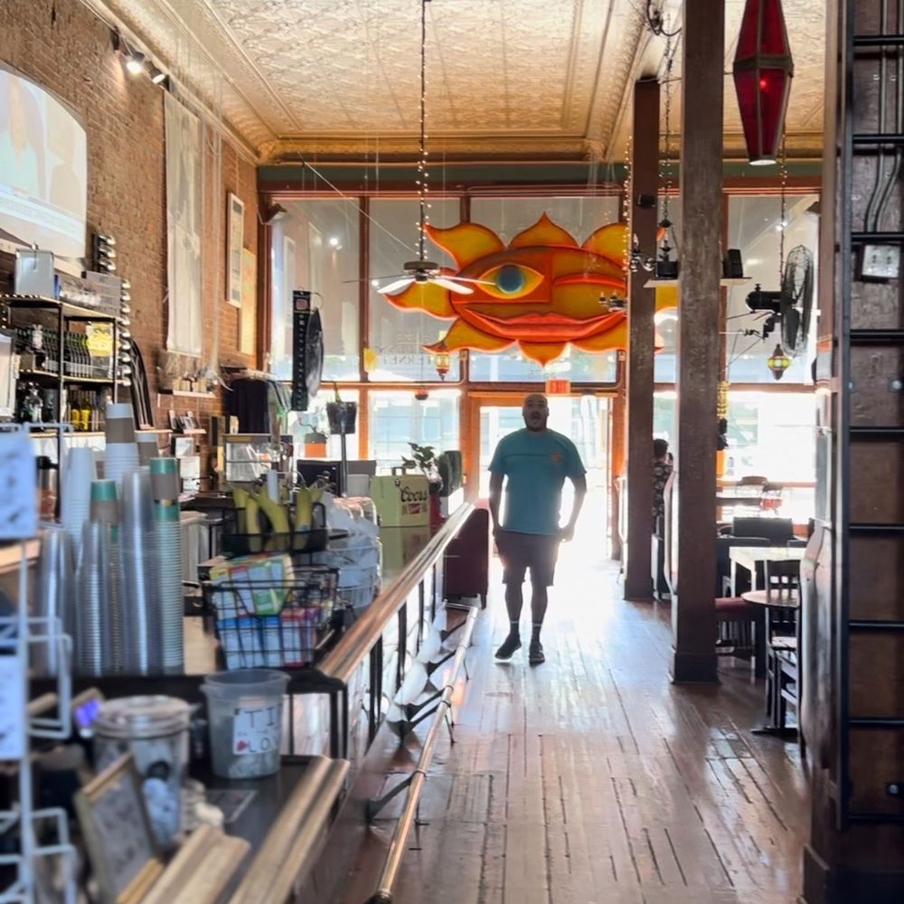 Back to the Grind - a man walking through a store - Coffee & Tea Near Me - Riverside, California Back to the Grind - a man walking through a store - Coffee & Tea Near Me - Riverside, California