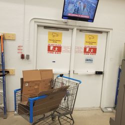 SmartCentres Winnipeg West - Two Fire exit doors  Pharmacy