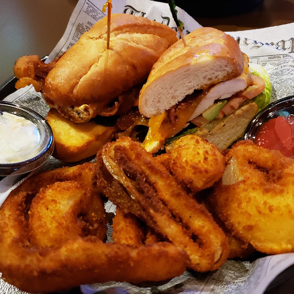Manny's Ale House - Santa Fe chicken sandwich with giant onion rings - Sports Bars Near Me - Elmhurst, Illinois