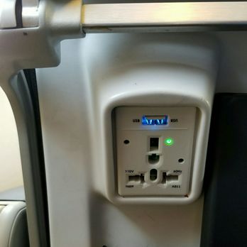 Alaska Airlines - Charging outlet in the seat back in front of mine. Love this! - Airlines Near Me - Denver, Colorado