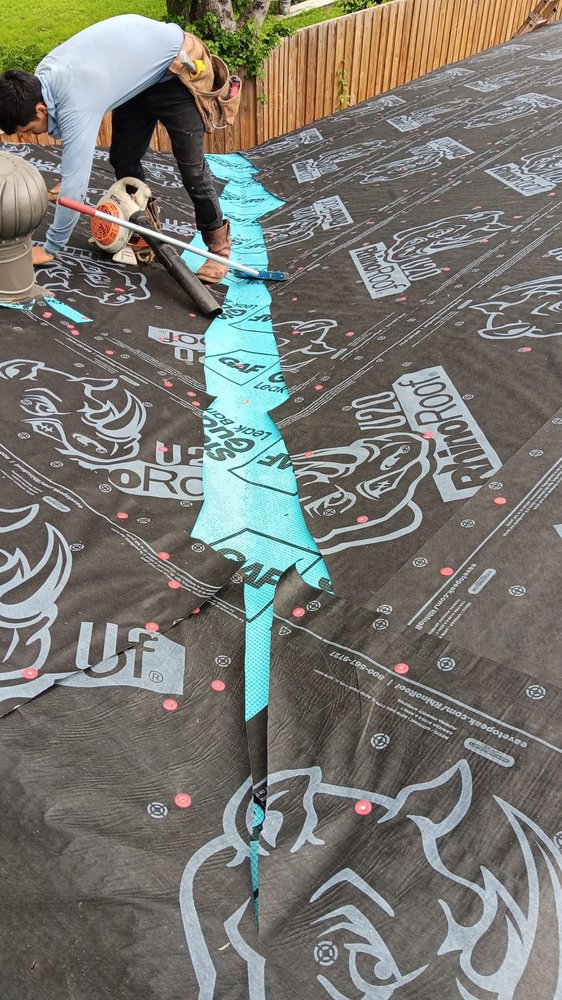 Slide of ME Roofing Company