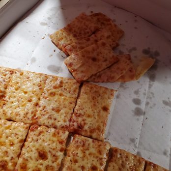 Luigi's Pizza - a slice of cheese pizza in a box - Pizza Near Me - Hilliard, Ohio