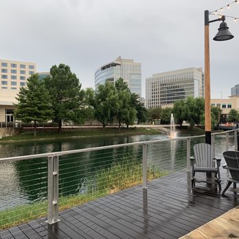 Granite Park - a view of a river and buildings - Diners Near Me - Plano, Texas Granite Park - a view of a river and buildings - Diners Near Me - Plano, Texas