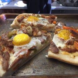 Don't expect boring stuff at this place. A breakfast pizza with sausages, potatoes and egg will sure start your day on the right tone!