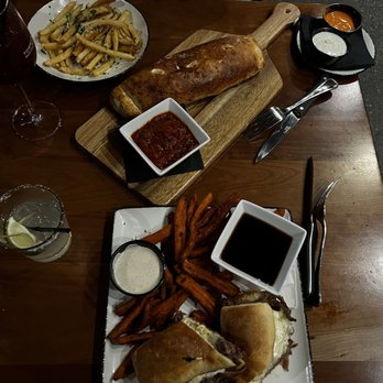 Tommy's Tavern + Tap - Top: Romano's Strombolis bottom: Tavern Dip sandwich with sweet potato fries - American Near Me - Freehold, New Jersey Tommy's Tavern + Tap - Top: Romano's Strombolis bottom: Tavern Dip sandwich with sweet potato fries - American Near Me - Freehold, New Jersey