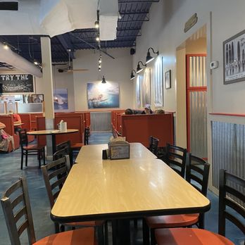 Dough Boy's Pizza - a dining area with tables and chairs - Pizza Near Me - Virginia Beach, Virginia